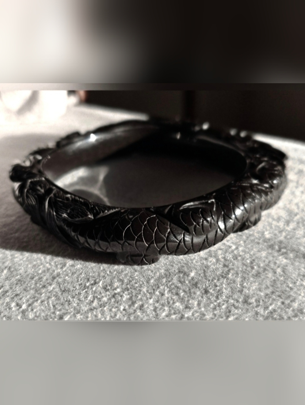 Carved vintage serpentine dragon bangle bracelet with deep detail.